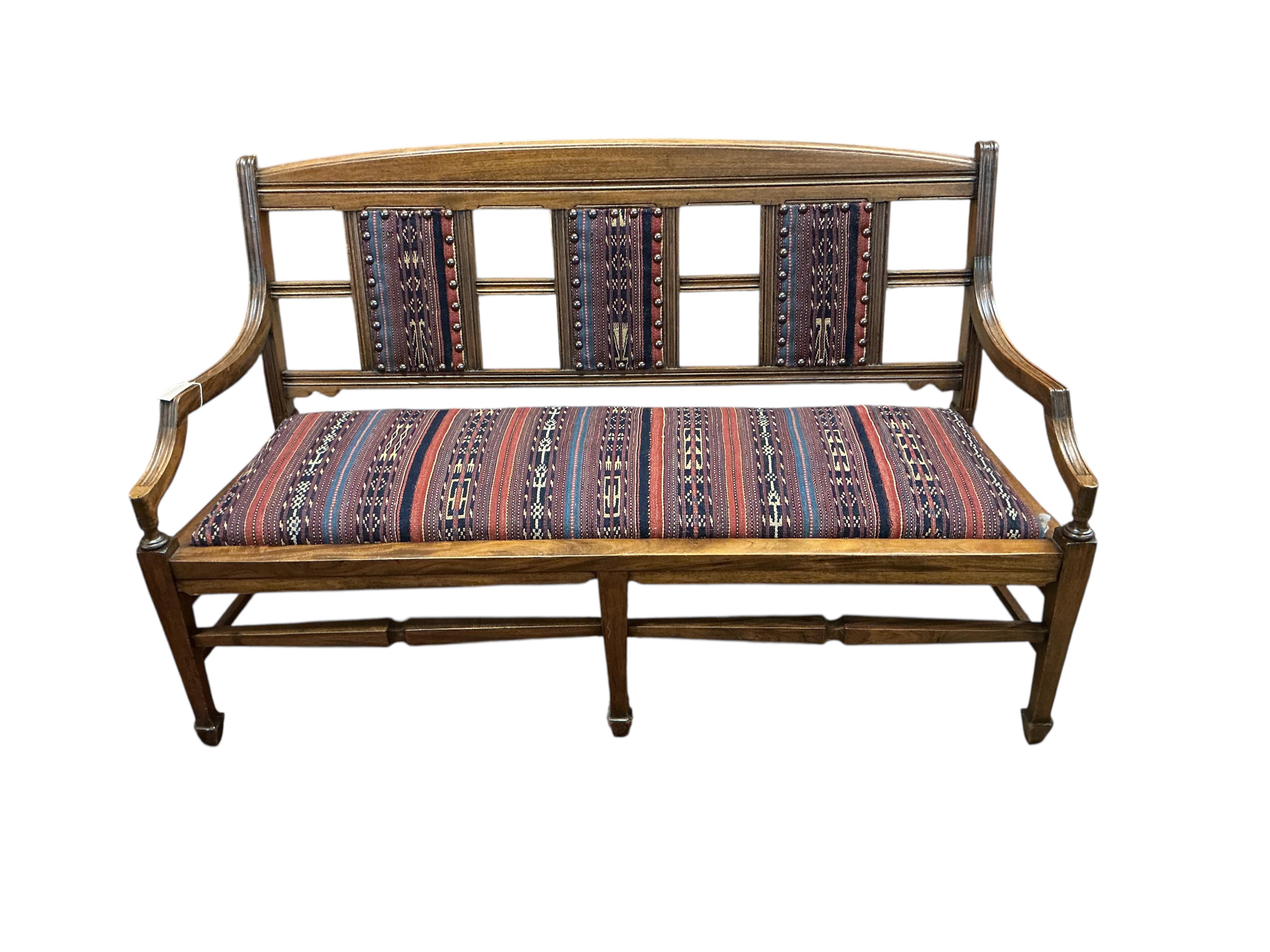 A late Victorian Aesthetic period walnut bench / settee, width 138cm, depth 50cm, height 80cm